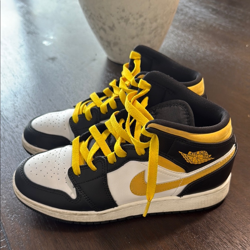 Nike Black and Yellow Sneakers with Iconic Design